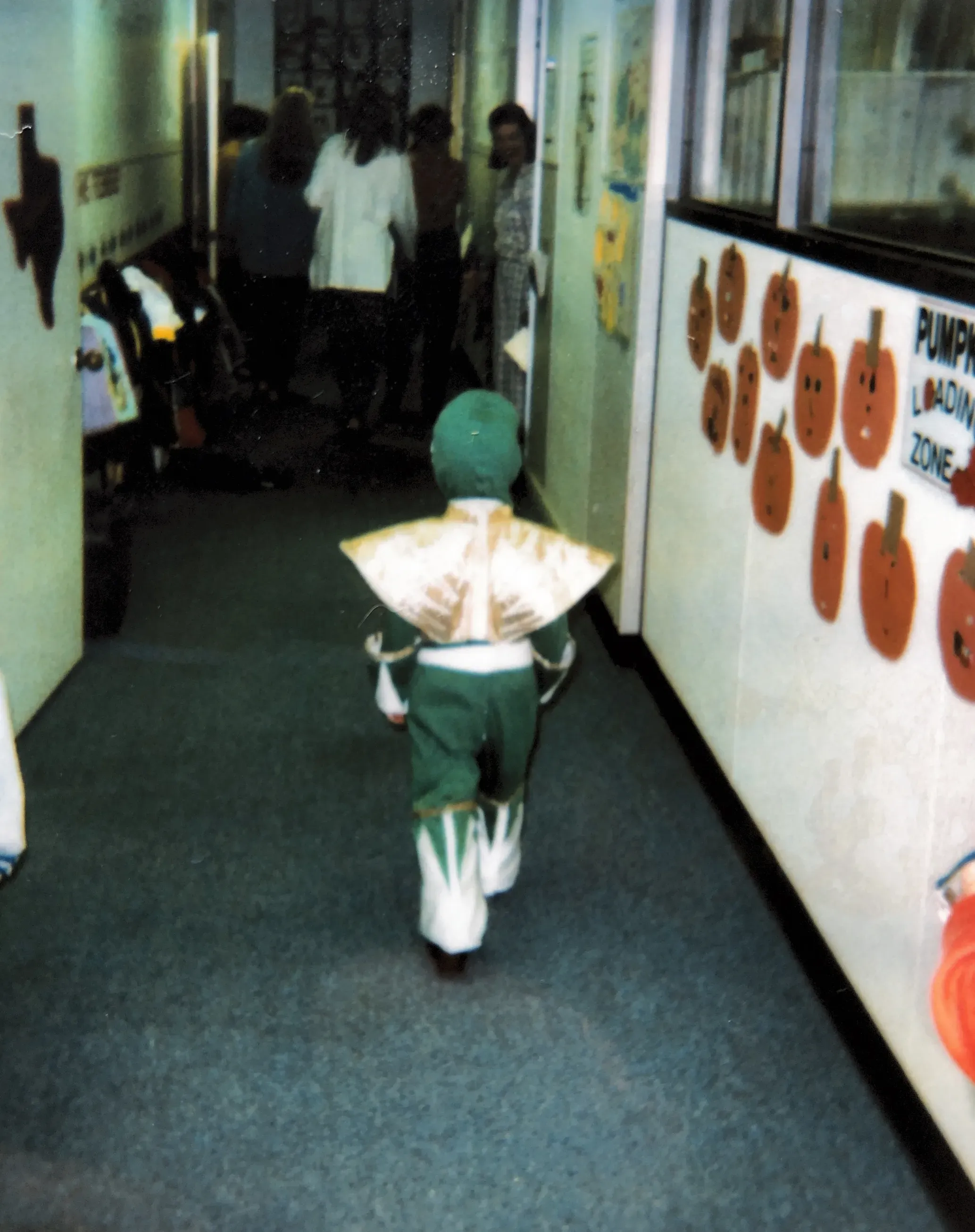 a child in a power ranger's costume walking away